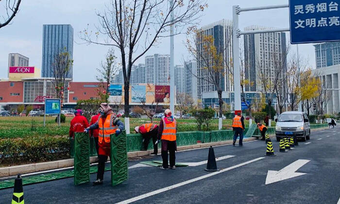 必赢入口守护冬季城市之美 烟台市莱山区的绿化带穿上“护身衣”(图1)